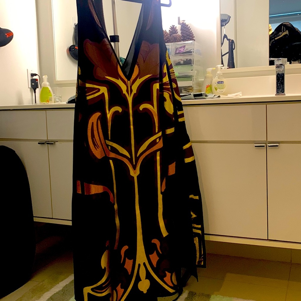 Gucci, 44, black and gold dress